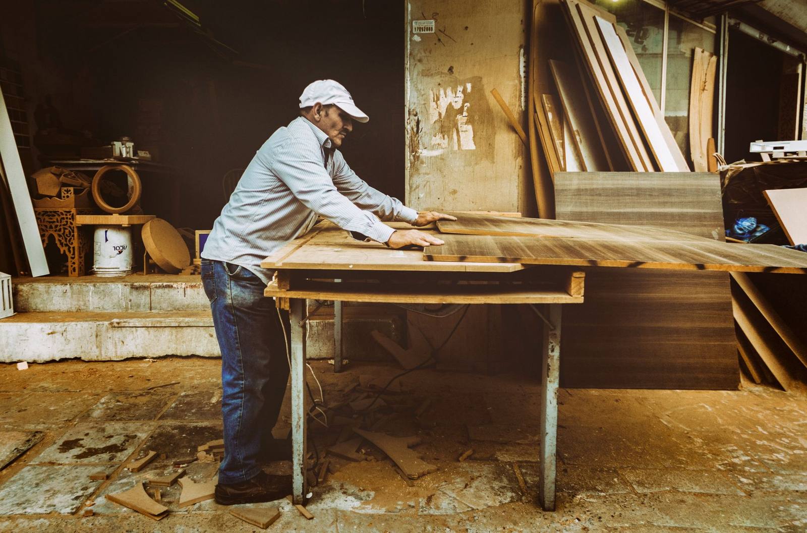 Joiner working timber in a workshop